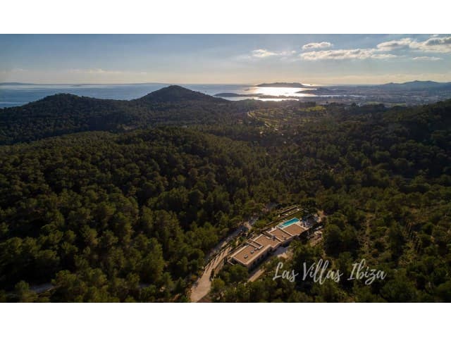Aerial view of Can Kef among dense pine woodland at sunset, S'Estanyol, Ibiza