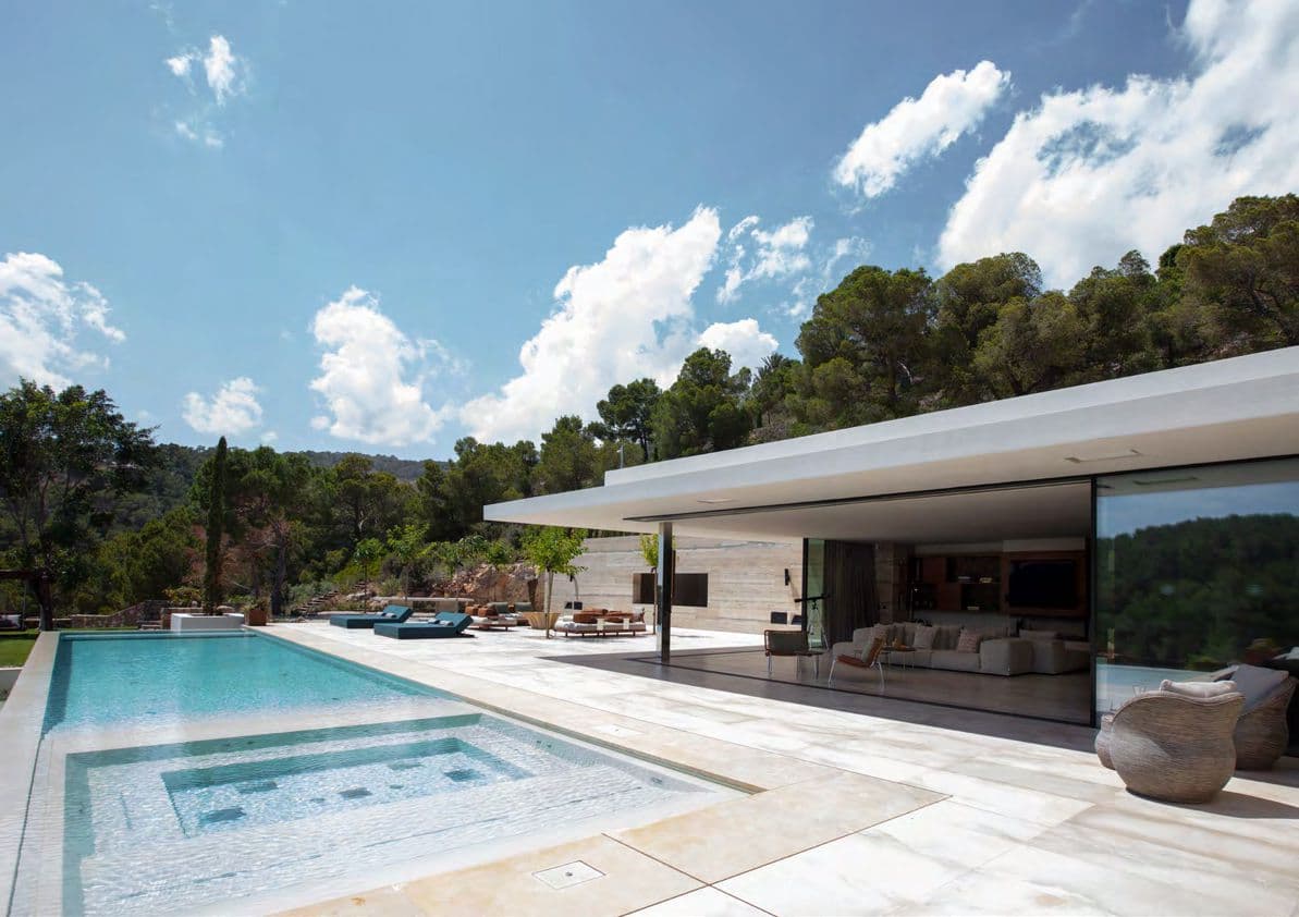 Swimming pool and terrace surrounded by pines at Can Kef, S'Estanyol, Ibiza