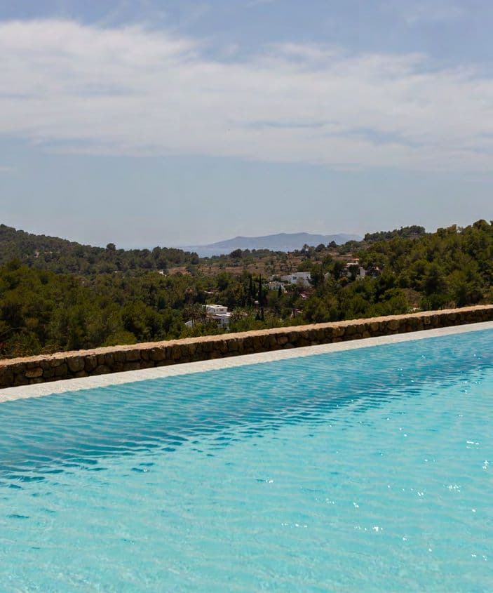 Infinity pool edge looking out across the countryside at Can Kef, S'Estanyol, Ibiza