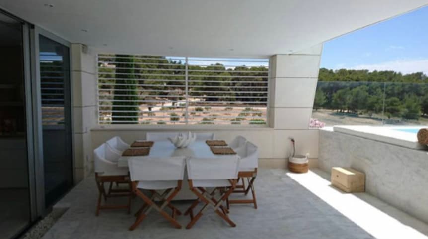 Terrace dining table with folding chairs at Piso Rubi, Marina Botafoc, Ibiza
