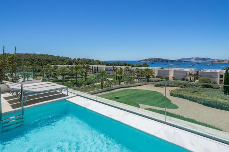 Swimming pool looking across the countryside to the sea, a luxury apartment at Es Pouet, Talamanca, Ibiza