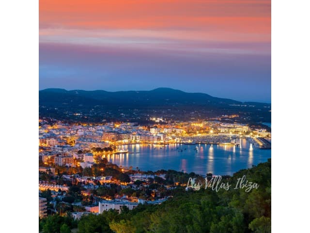 Ibiza town and its harbour lit at night, seen from Casa Hacienda, Cas Mut, Ibiza