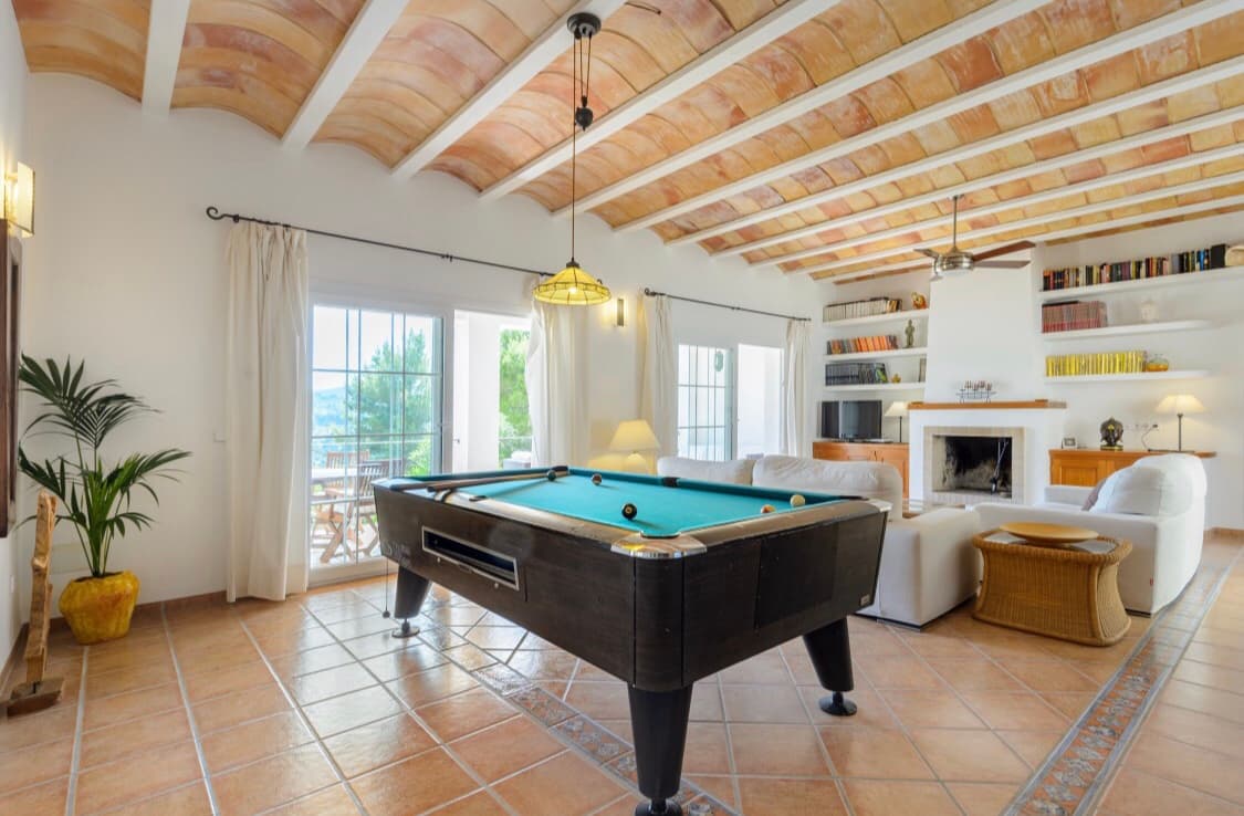 Games room with a pool table beneath a beamed ceiling, Sant Josep, Ibiza