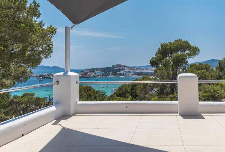 White terrace facing the open water at Villa Blanca, Cap Martinet, Ibiza