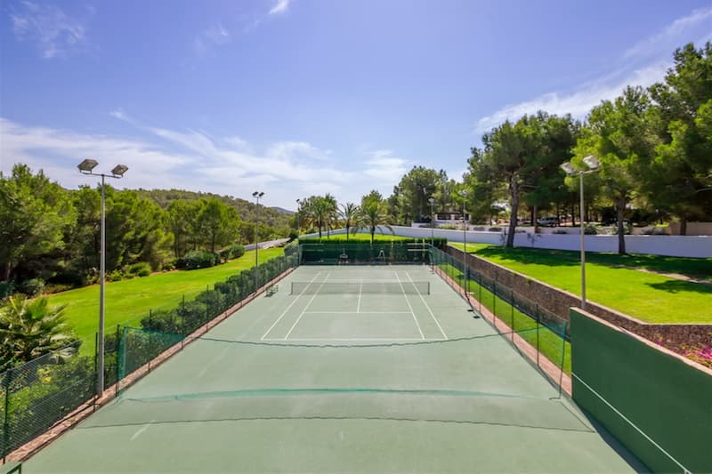 Floodlit tennis court within the grounds at Villa Predo, Es Cubells, Ibiza
