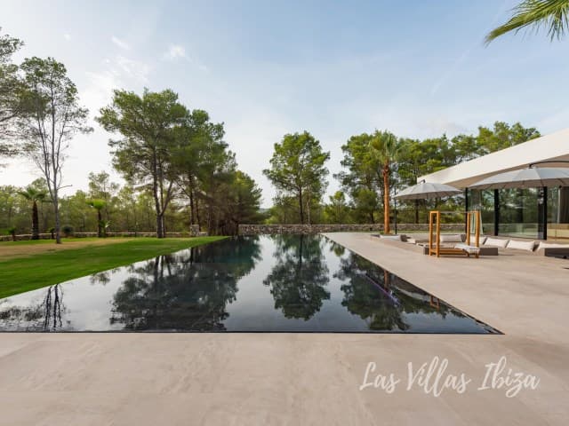 Long reflecting pool and manicured lawn in front of Villa Azul, Santa Gertrudis, Ibiza