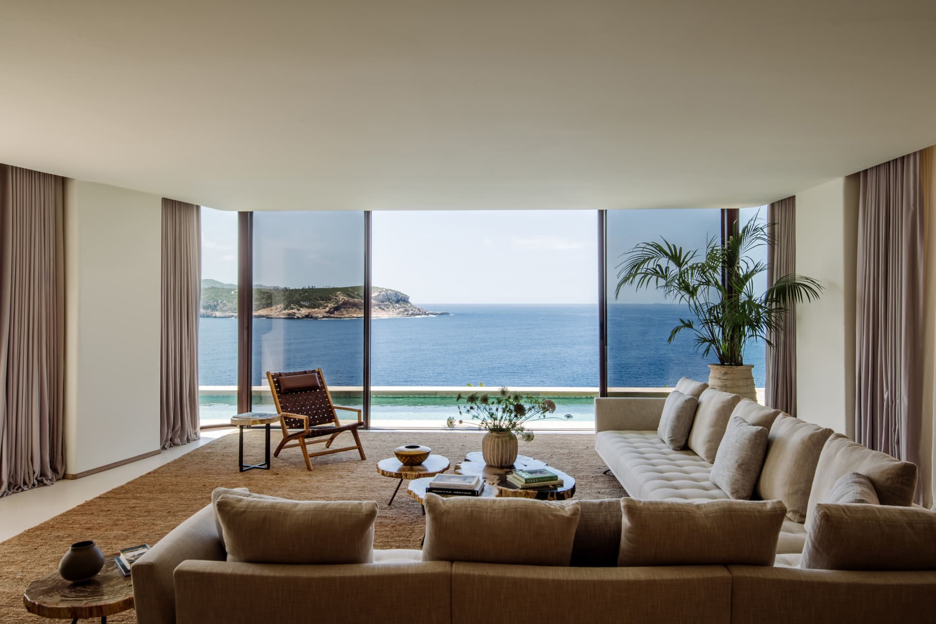 Living room with full height glass looking straight out to sea, Portinatx, Ibiza