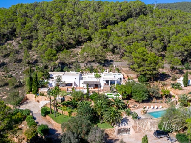 Aerial view of Can Nik surrounded by dense pine woodland, Sa Carroca, Ibiza