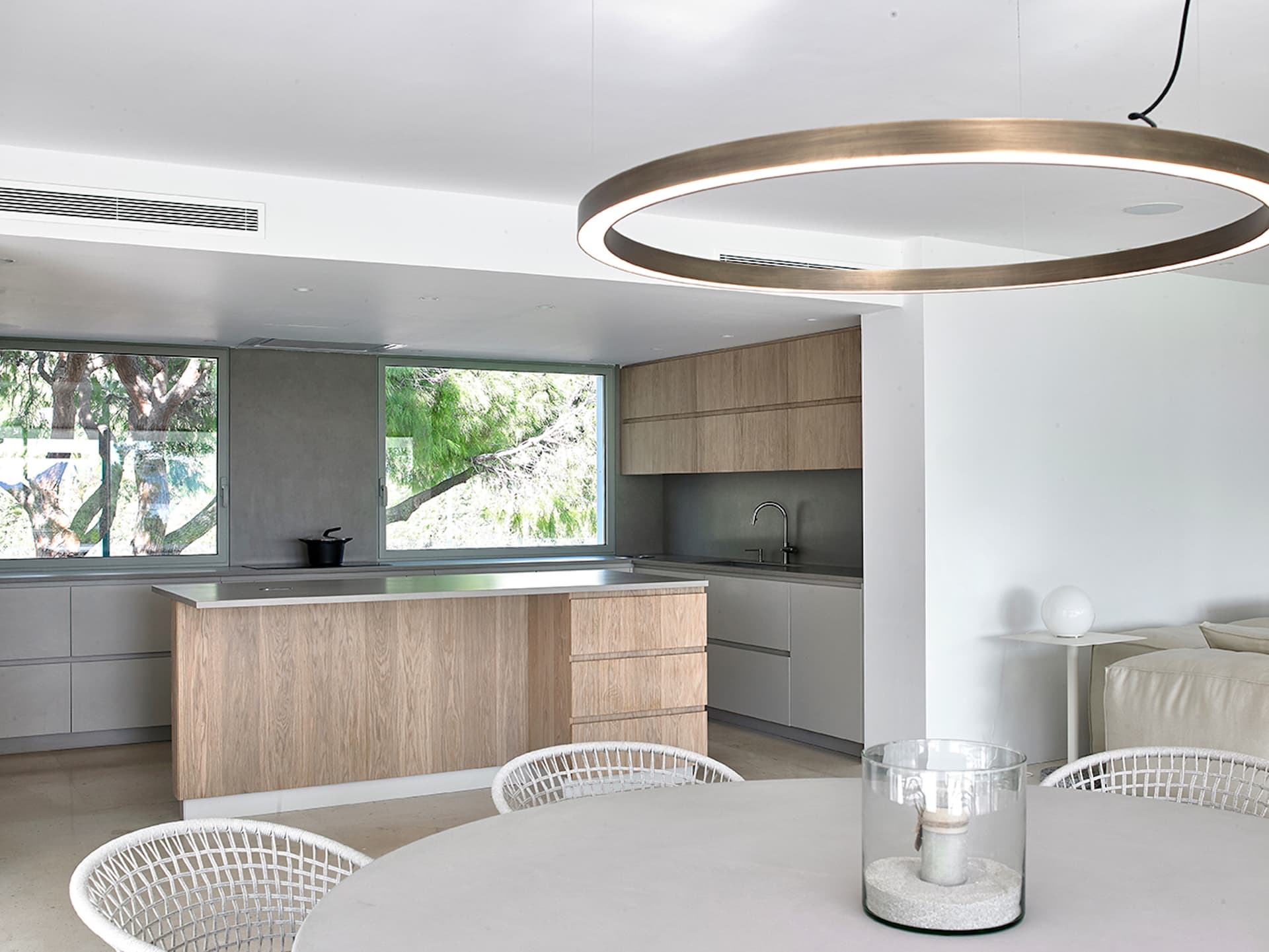 Kitchen with an island and a circular pendant light at Can Nuri, Sant Jordi de Ses Salines, Ibiza