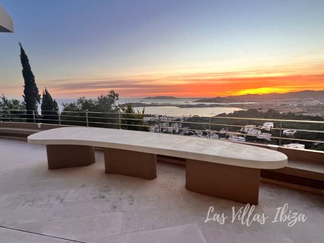 Curved terrace bench facing the sunset over the bay at Villa Abigail, Talamanca, Ibiza