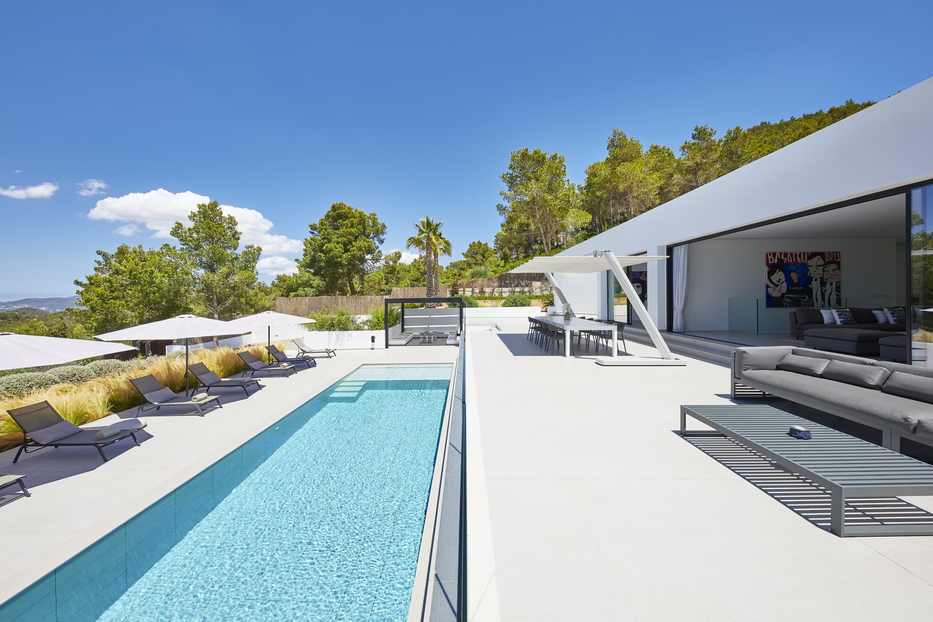 Swimming pool and terrace below the living spaces at Villa Lucy, Sant Josep, Ibiza