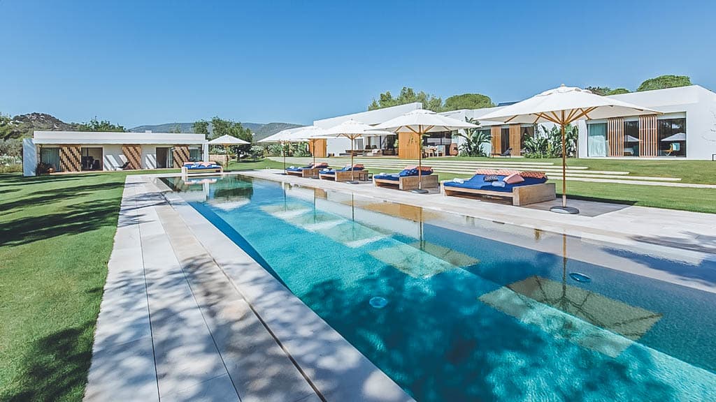 Swimming pool enclosed by clipped hedging at Villa Marion, Sant Josep, Ibiza