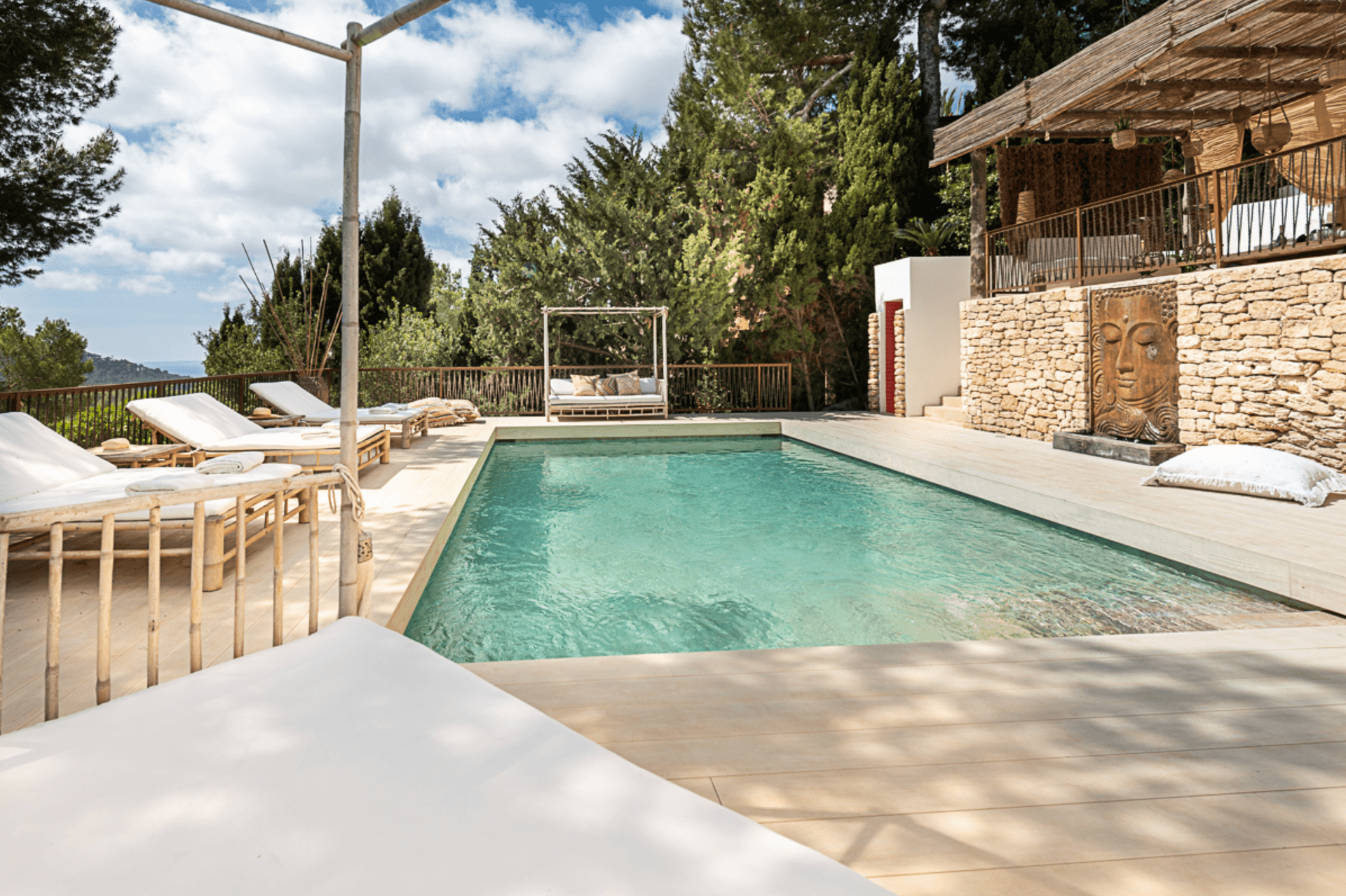 Sun loungers beside the pool with a thatched shade structure, Can Furnet, Jesus, Ibiza