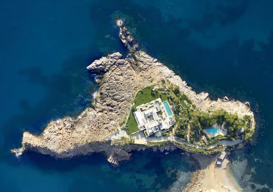 Aerial view of the rocky islet and clear water below Villa Perdiz, Puerto de San Miguel, Ibiza