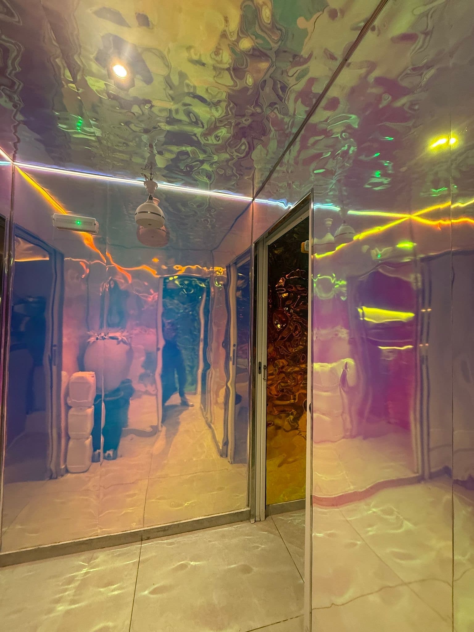 Corridor washed in iridescent light at Aguamarina, S'Eixample, Ibiza
